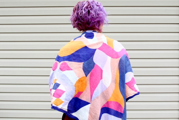 Outfit details: multi colored blanket scarf and curly lavender hair